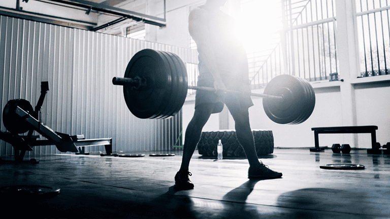 Lifting heavy weights is a key part of how to build muscle after 40